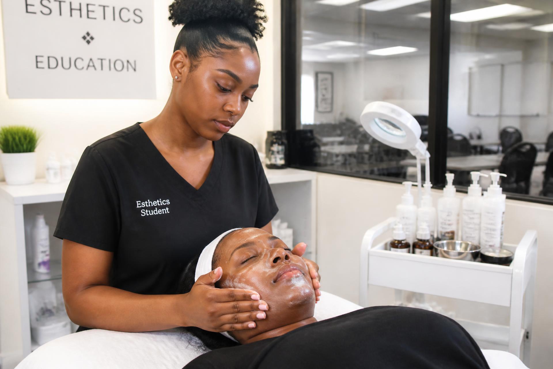 Esthetics student performing a facial treatment in the skin care room
